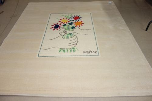 After Pablo Picasso; 'Le Bouquet', wool rug with signature lower left and numbered 338/500 on a label on reverse, 238cm x 171cm. Published by Desso, N