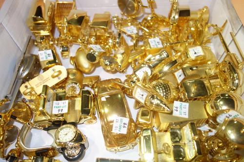 A quantity of 20th century miniature novelty gilt clocks, including examples formed as vehicles, sporting items and sundry, (approximately 40).  CAB