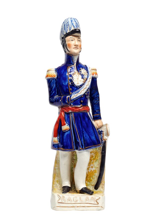 A Staffordshire portrait figure of Field Marshall Lord Raglan, 19th century, polychrome painted on a gilt titled base, 33cm high.  Illustrated