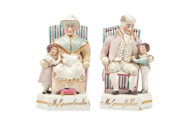 A pair of Staffordshire bookend figures, 'My Grandfather' and 'My Grandmother', circa 1840, polychrome painted, each modelled seated with a child besi
