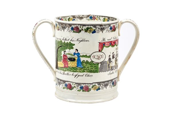 A Staffordshire two-handled loving cup, 19th century, printed in black and over-painted with Masonic verse; 'Everyone helped his neighbour is said to