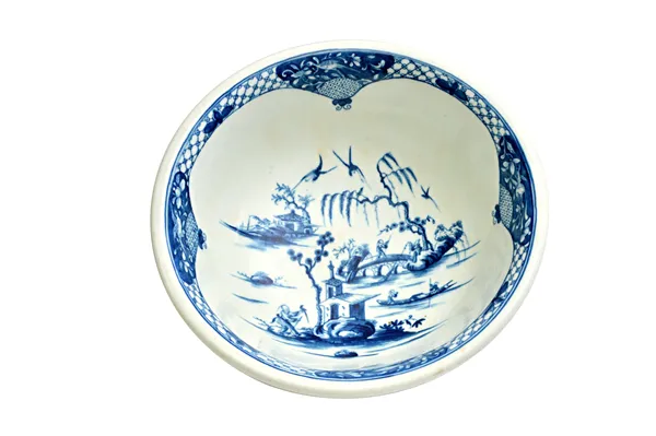 A Worcester blue and white porcelain basin, circa 1765, painted with the 'Willow Bridge Fisherman' pattern, blue open crescent mark to the base, 28cm