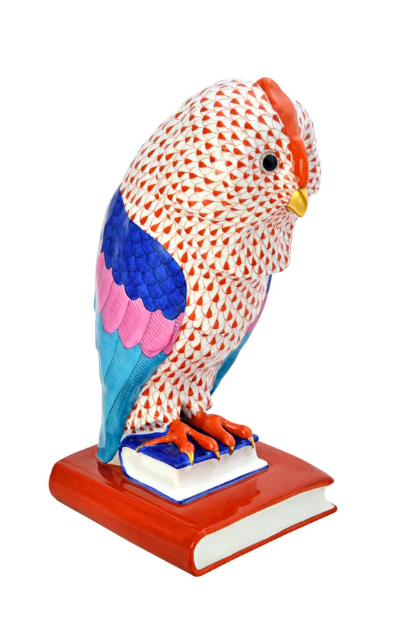 A large Herend porcelain owl, gilt Imari decorated, perched atop two graduated books, printed and incised marks, 29.5cm high.  Illustrated