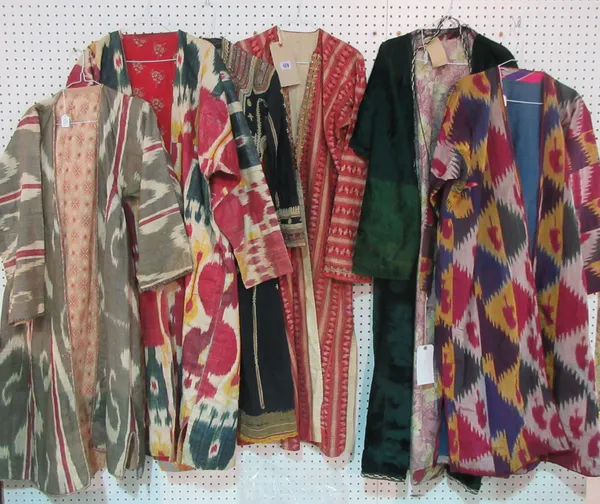 Clothing; A group of six early 20th century and later Persian and Persian style robes and coats, a scarf, some material and three pairs of shoes, (qty