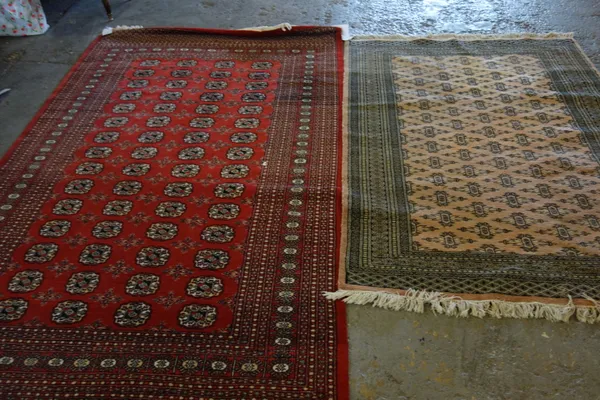 Two Indian Bokhara design carpets, pink and red grounds, 258cm x 154cm and 130cm x 180cm, (2).C3