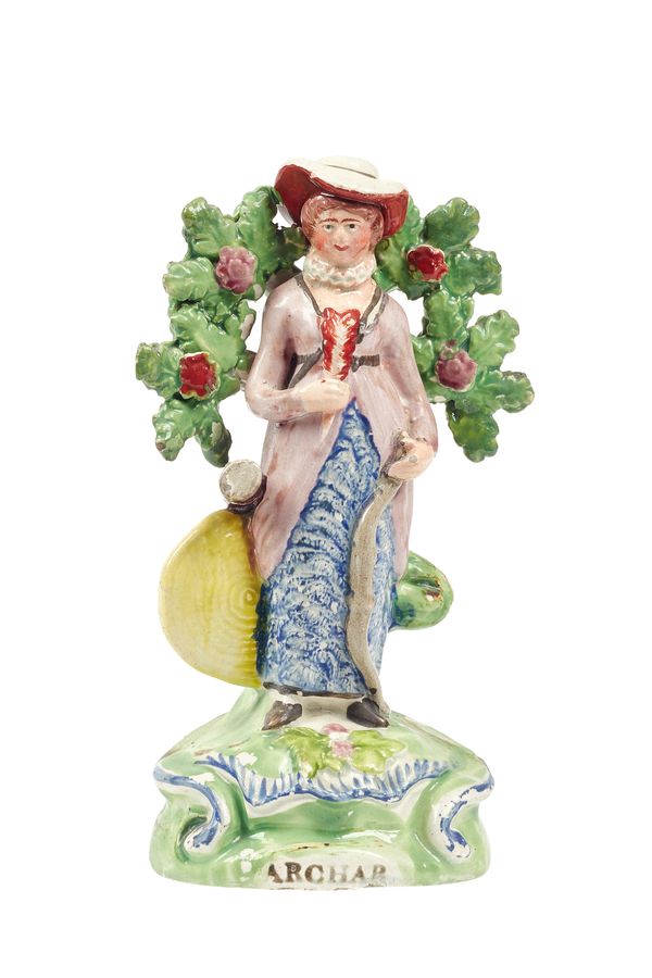 A Staffordshire pearlware figure 'Archar', early 19th century, depicting a lady with bow and quiver of arrows, against a floral bocage, on a titled na