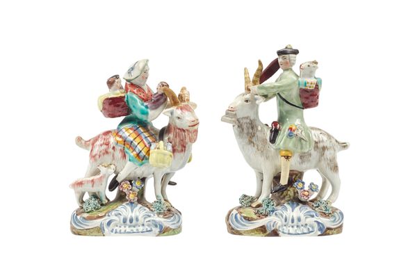 A pair of Staffordshire pearlware figure groups, 'Welch tailor and wife riding goats', early 19th century, each on a naturalistic shell scroll base, 1