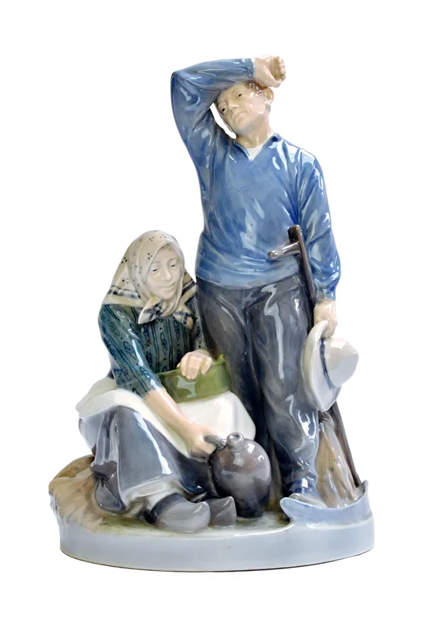 A Royal Copenhagen porcelain figure of farm workers, by Christian Thomson, no.1352, 42cm high.  Illustrated