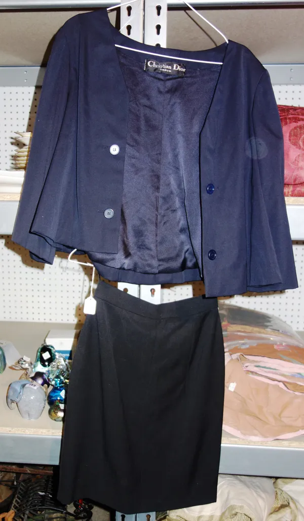 Designer Clothing, comprising;  A Christian Dior short swing style jacket (size 10-12) and a Chanel black short skirt (size 8). (2)   RAIL