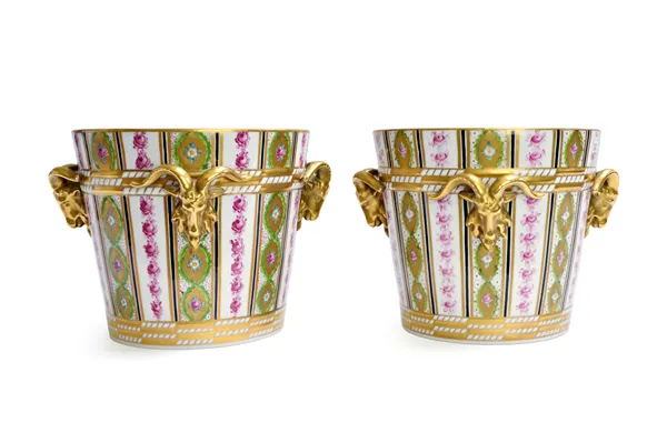 A pair of Dresden porcelain jardinieres, 20th century, each with three applied gilt rams head handles against a gilt foliated decorated ground, blue p