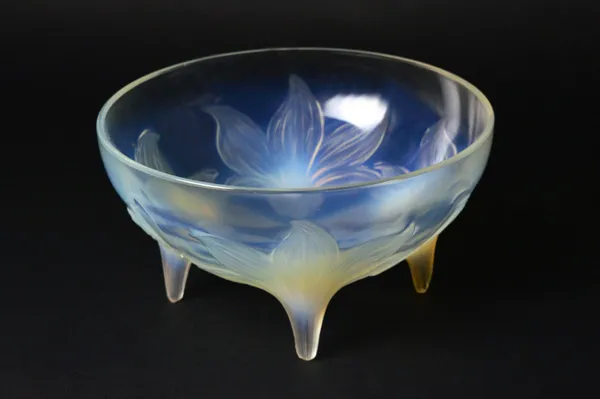 A Lalique clear and frosted glass 'Lys' pattern bowl, pre-war, raised on four foliate feet, moulded mark 'R. Lalique', and a further, possibly later e
