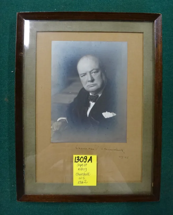 WINSTON CHURCHILL - the well-known Wartime photograph (by Walter Stoneman) shows him seated at the Cabinet table, half length & facing camera; 14 x 11
