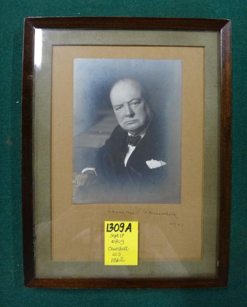 WINSTON CHURCHILL - the well-known Wartime photograph (by Walter Stoneman) shows him seated at the Cabinet table, half length & facing camera; 14 x 11