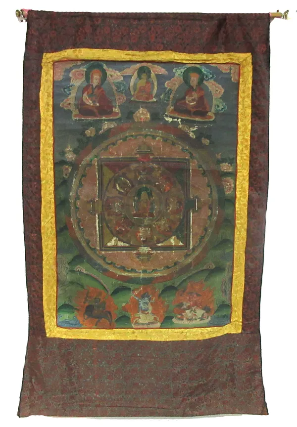 A 19th century Tibetan Thangka painted panel, depicting gods and goddesses on later silk mounting.  A7