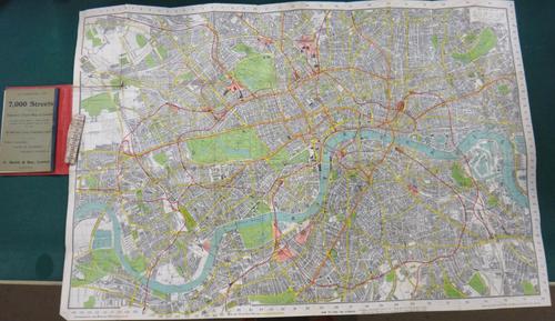 C. SMITH & SON'S  Tape Indicator Map of London.  62 x 90cms. colour-printed, folded on linen within cloth covers, scale 3 1/2ins. to mile, with the at