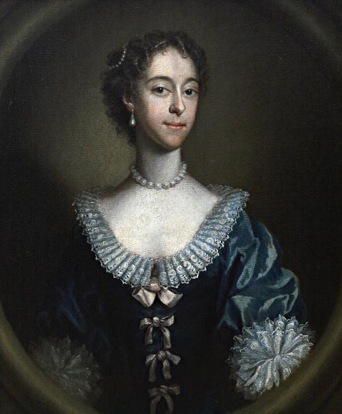 Circle of John Astley, Portrait of a lady, in a feigned oval, oil on canvas, 74cm x 61cm.  Illustrated