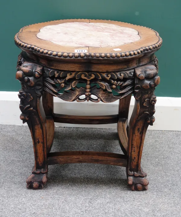 A late 19th century Chinese carved hardwood jardiniere stand, with inset marble top, 55cm wide x 46cm high.