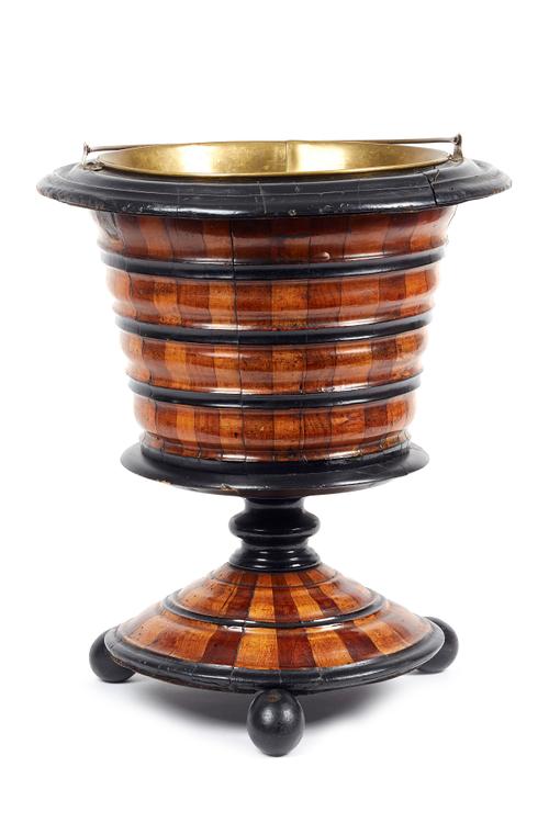 A 19th century Dutch fruitwood jardiniere, with ribbed body and flared circular base, 37cm wide x 44cm high.  Illustrated