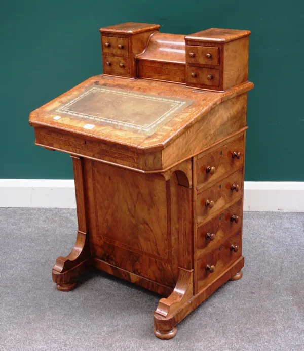 A Victorian figured walnut and bird's eye maple Davenport, with fitted piano top over sloped front and four side drawers, 56cm wide x 92cm high.