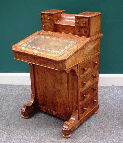 A Victorian figured walnut and bird's eye maple Davenport, with fitted piano top over sloped front and four side drawers, 56cm wide x 92cm high.