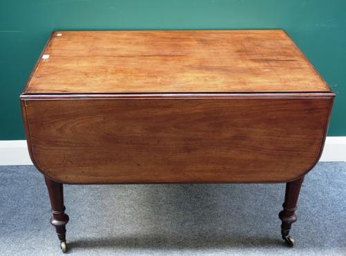 T.P Seddon; a Regency mahogany drop-flap Pembroke table on tapering turned supports, 106cm deep x 66cm across, 137 across open.