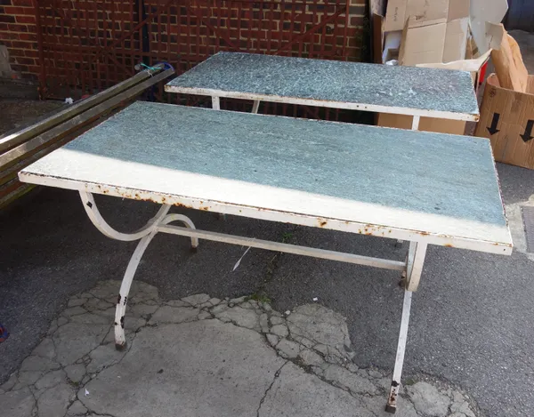 A pair of rectangular tables, each with inset stone top on a white painted metal base, with X-frame supports, 152cm x 76cm, (2).