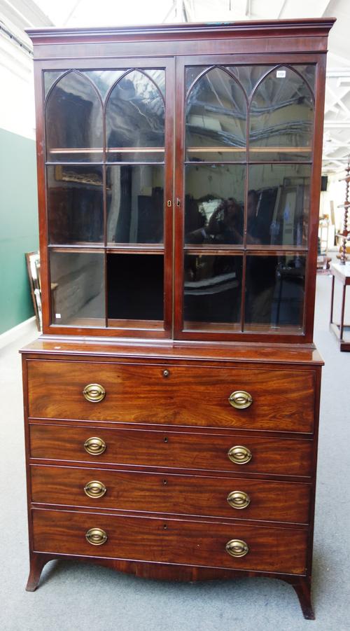 A George III mahogany secretaire bookcase, the pair of astragal glazed doors over fitted drawer and three further long drawers, on splayed bracket fee