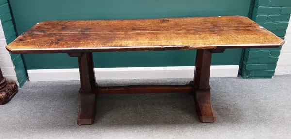 A 17th century style rustic oak refectory table, with single scanted rectangular slab top on pair of octagonal supports, united by stretcher, 79cm wid