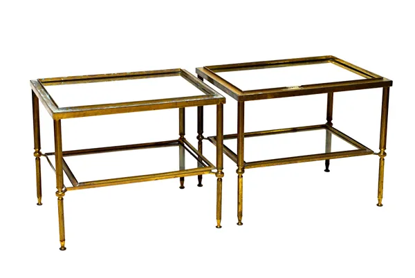 A pair of early 20th century French rectangular lacquered brass two tier occasional tables, with mirror insets and fluted supports, 62cm wide x 52cm h
