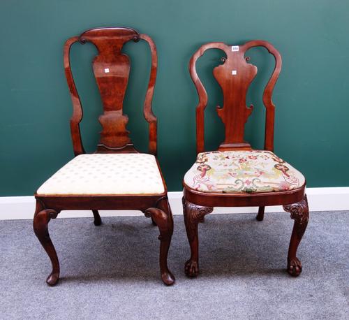 An early 18th century style walnut framed vase back chair on claw and ball feet, 56cm wide x 99cm high, together with another similar, (2).