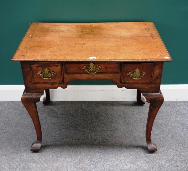 A mid-18th century lowboy, with three frieze drawer on square cabriole supports, 83cm wide x 67cm high.
