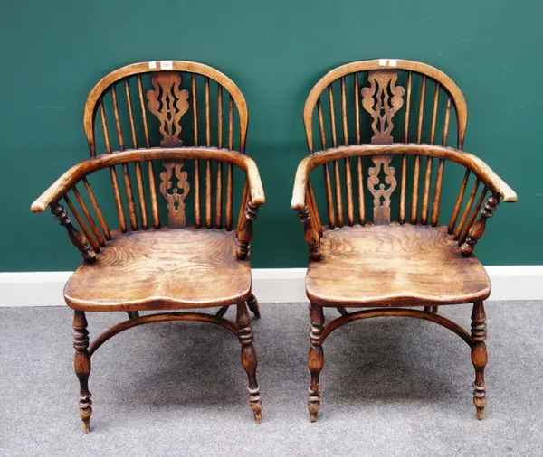 A pair of George III style elm and ash Windsor chairs, each with pierced splat and solid seat, on turned supports united by crinoline stretcher, 50cm