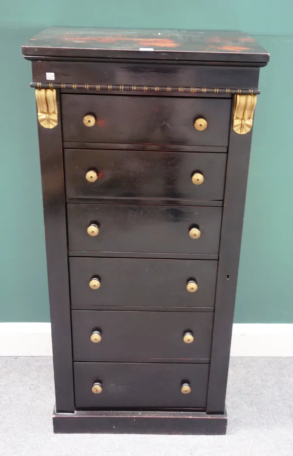A Victorian ebonised parcel gilt Wellington chest, with six drawers enclosed by locking bar, on plinth base, 59cm wide x 124cm high.