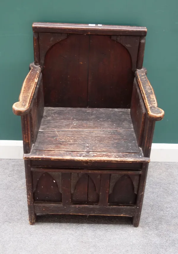A 19th century pine Gothic Revival panel back lift top box seat, 67cm wide x 97cm high.
