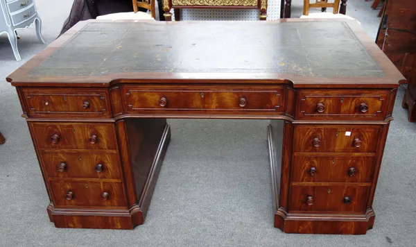 An 18th century style mahogany inverted breakfront pedestal desk, with nine drawers about the knee and opposing pedestal cupboards, 152cm wide x 91cm