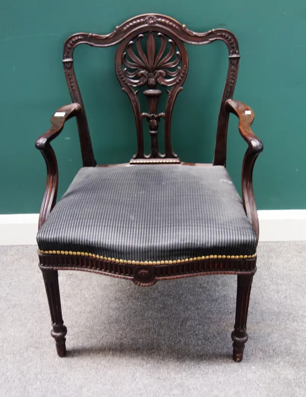 A George III mahogany framed carver chair, with pierced and carved splat and serpentine seat, on tapering fluted supports, 65cm wide x 93cm high.