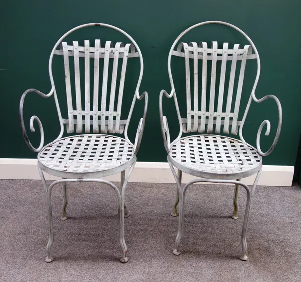 A set of eight 20th century grey painted steel armchairs, with scroll arms and lattice seats, each 55cm wide x 103cm high, (8).