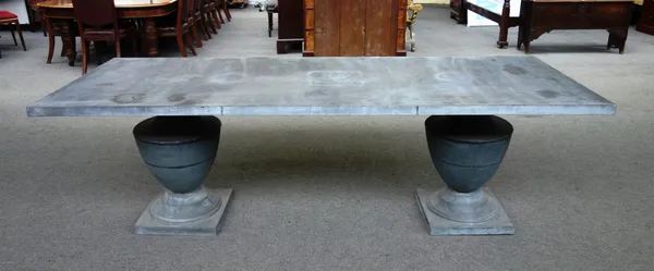 A 20th century zinc covered rectangular garden table, on twin baluster supports, 91cm wide x 241cm long.