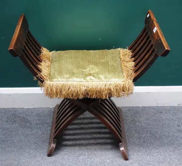A 19th century oak folding X-frame chair of slatted construction, 75cm wide x 67cm high.