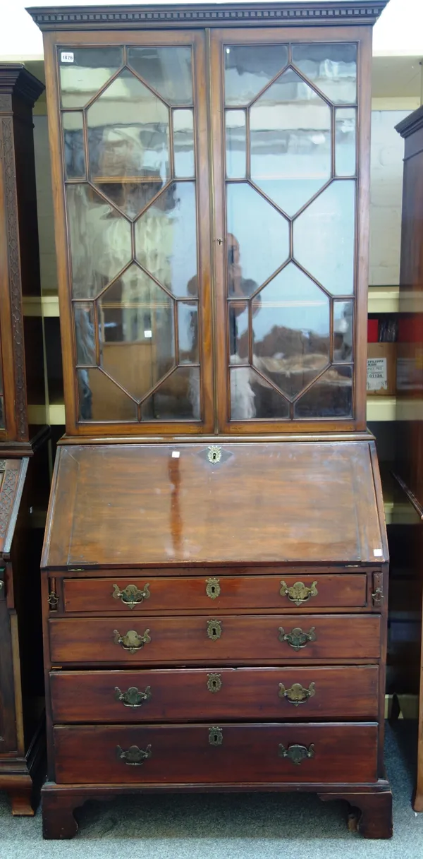 A George III mahogany bureau bookcase, the pair of astragal glazed doors over fitted interior and four long drawers, on bracket feet, 94cm wide x 219c
