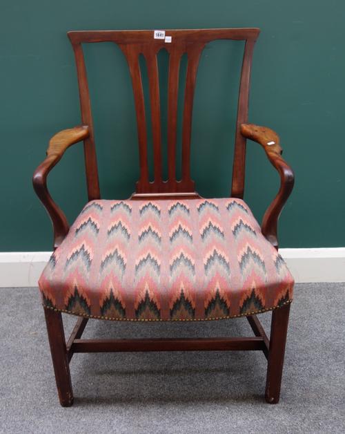 A George III mahogany carver chair, with pierced splat back on canted block supports, 64cm wide x 95cm high.