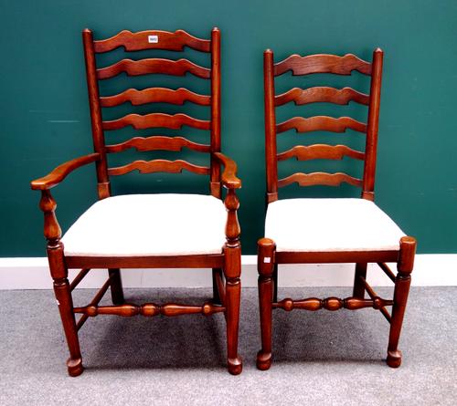 A set of eight 18th century style Lancashire wavy ladder back dining chairs on turned supports, to include a pair of carvers (8).