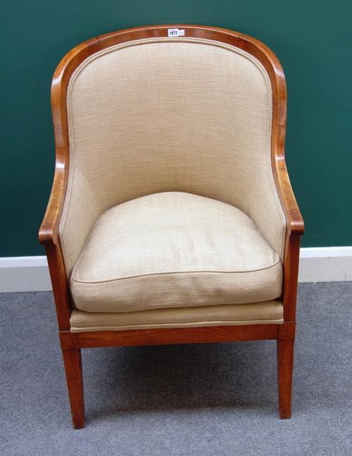 A late 19th century Continental walnut framed tub back chair, on sabre supports, 65cm wide x 99cm high.