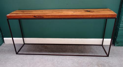A mid-20th century console table, the rectangular coromandel top on a bronzed metal box tube base, 176cm wide x 80cm high.