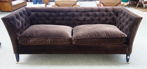 Sofa.com; a chocolate brown button upholstered square back sofa, on tapering ebonised supports, 125cm wide x 92cm high.