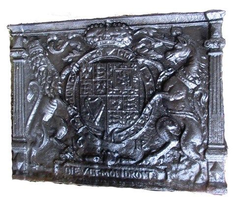 A James I style cast iron fireback, relief cast with the royal standard, 86cm wide, 63cm high.   OUTSIDE
