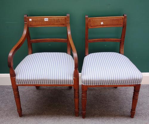 A set of six early 19th century mahogany framed dining chairs, on turned supports, to include a pair of carvers, (6).