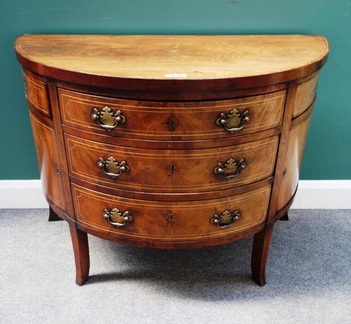 A small George III inlaid mahogany semi-elliptic sideboard, with three central drawers flanked by cupboards and swivel-out drawers, on splayed square