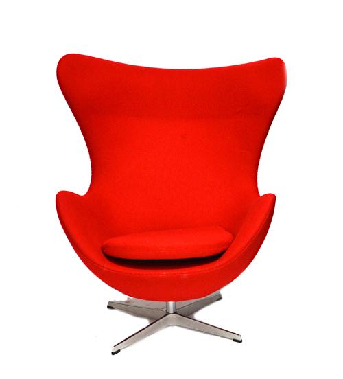 Republic of Fritz Hansen; a late 20th century 'Egg' chair, in red upholstery, on a four point polished steel base, 80cm wide x 105cm high.  Illustrate