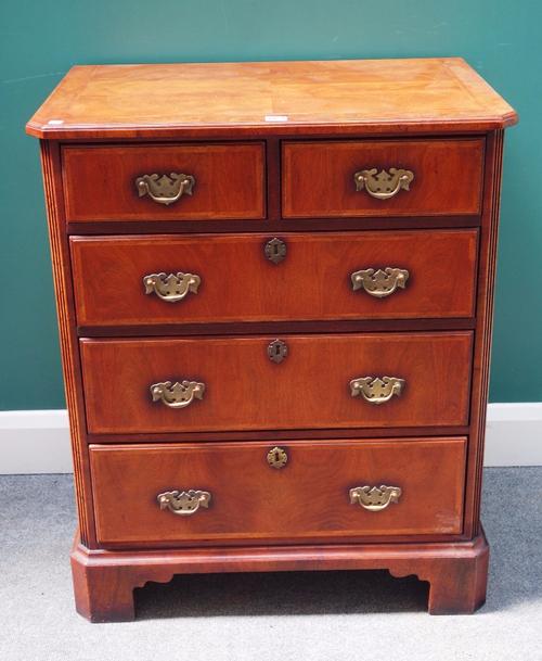An early 18th century style small walnut chest of two short and three long graduated drawers, on bracket feet, 73cm wide x 89cm high.